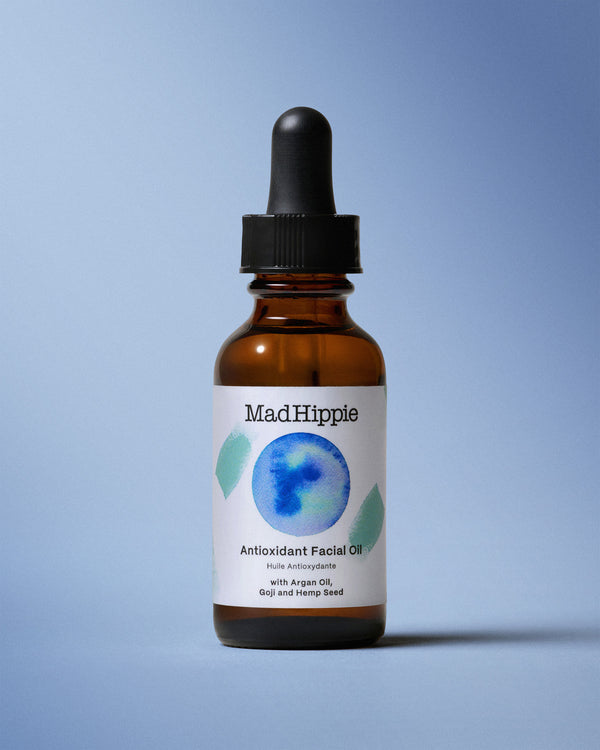 Antioxidant Facial Oil Bottle on Blue Background
