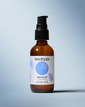Cleansing Oil Bottle on Blue Background